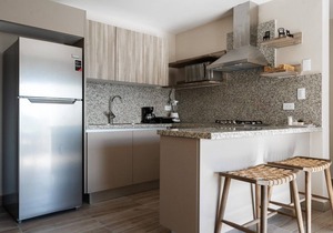 Designer condo near Blue Mall with rooftop pool and city views | YellowKey in Santo Domingo
