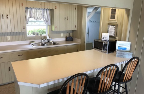 Suttons Bay House | Beautiful Cottage on the Water of Pristine West Bay