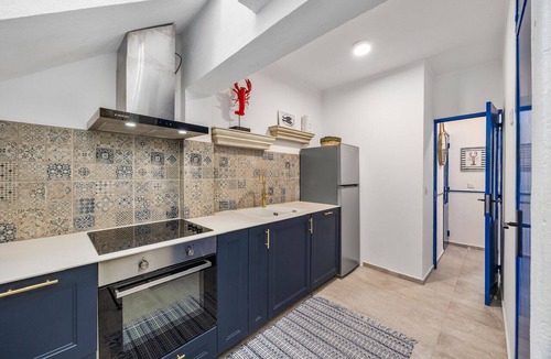 Portimao City Centre House | Just steps from Portimão's promenade, marina and beaches, this stylish home offers AC, sun deck with jacuzzi, a fully equipped kitchen and comfortable living spaces. Perfect for families, friends or business stays exploring the Algarve.