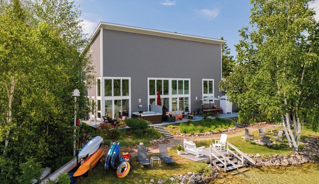 Contemporary Waterfront Home on North Lake Leelanau with Hot Tub and Dock in Lake Leelanau