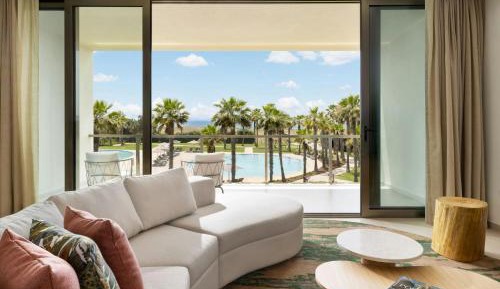 Junior King Suite with Balcony and Pool View