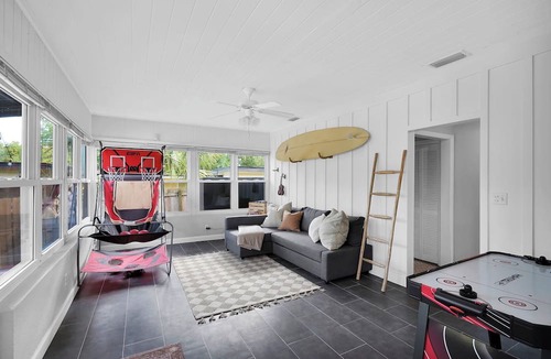 Lakewood House | Mid-Century Boho Chic home with Pool, Game Room & Outdoor Playhouse.