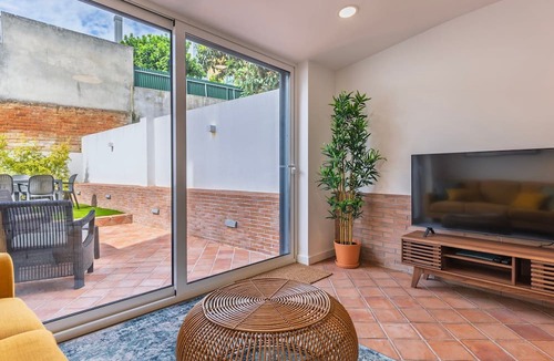 Santa Engracia Apartment | Sunny Garden 2BDR Apartment by LovelyStay